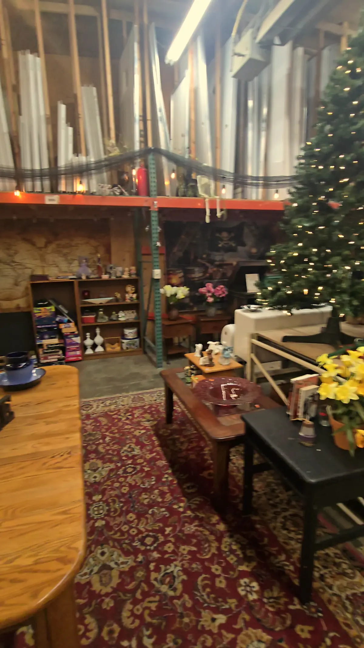 The warehouse aisle with a Christmas tree and furniture