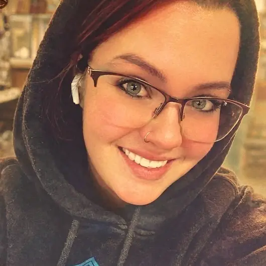 Kacey, co-owner of Buried Treasures, smiling