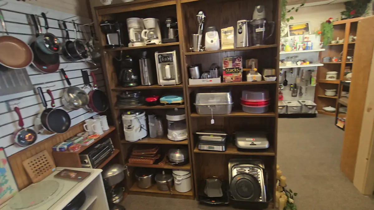 Shelves of pots, pans and small appliances