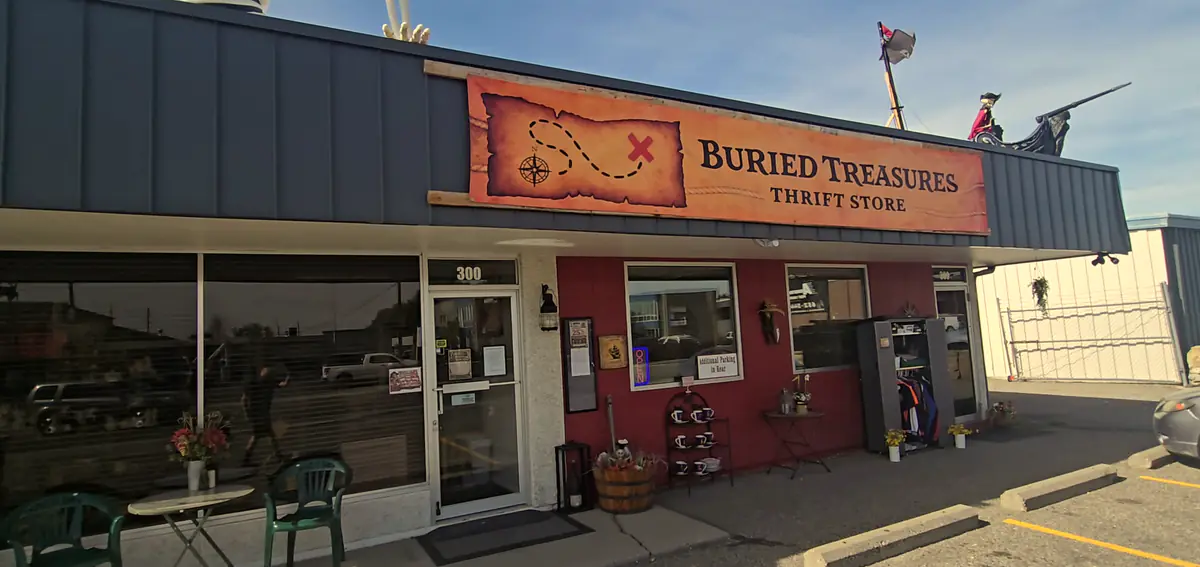 The Buried Treasures storefront on Moore Lane under a blue sky